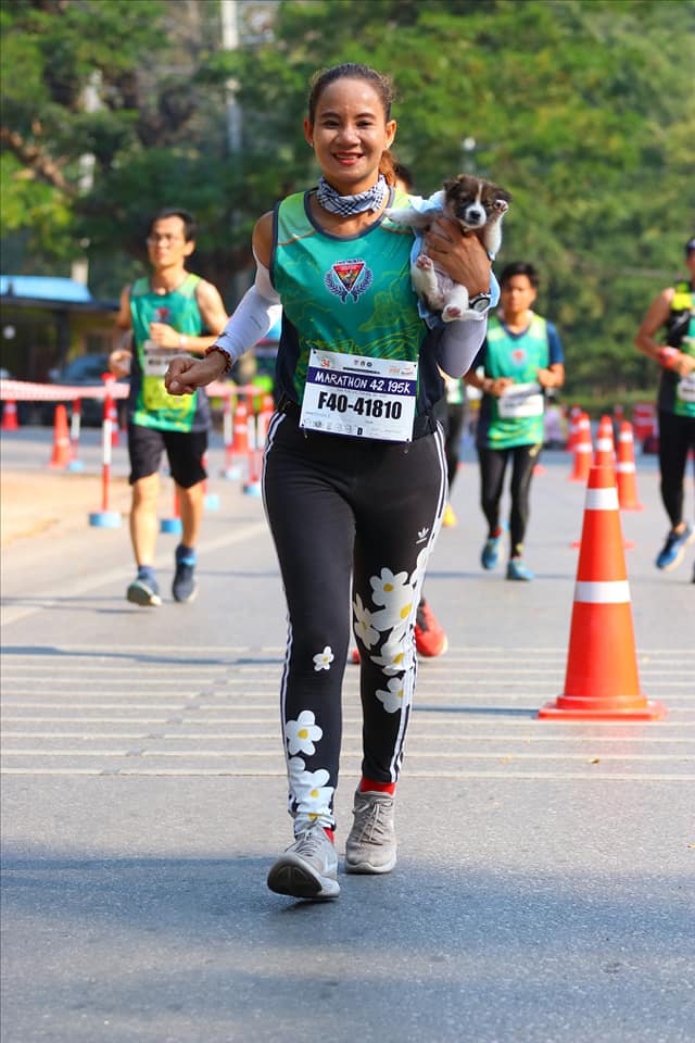 Marathon Runner Khemjira With Puppy